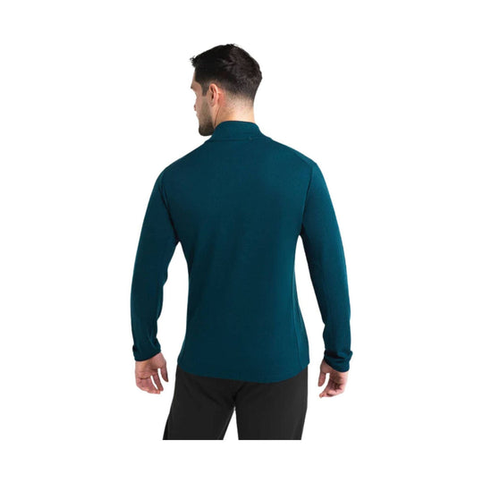 Teal long-sleeve performance jacket shown from the back