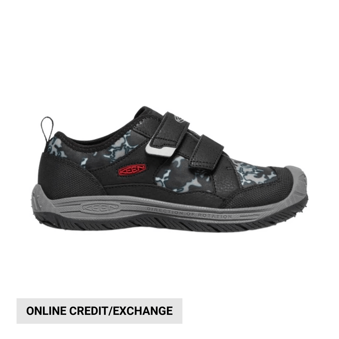 Black-and-gray children’s sneaker with two velcro straps and a white sole, shown in side view.