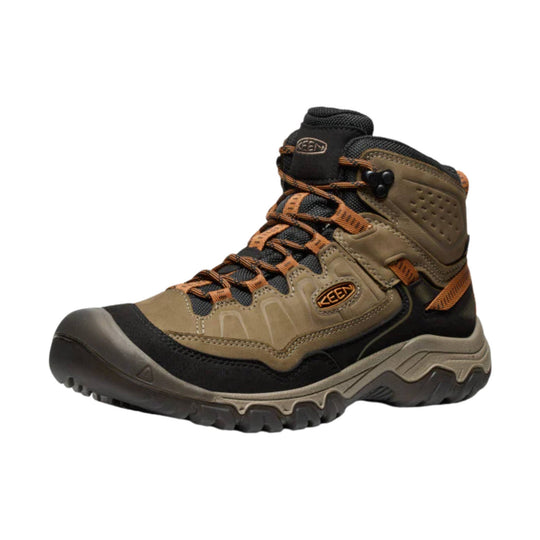 Tan and black hiking boot with orange laces and KEEN logo