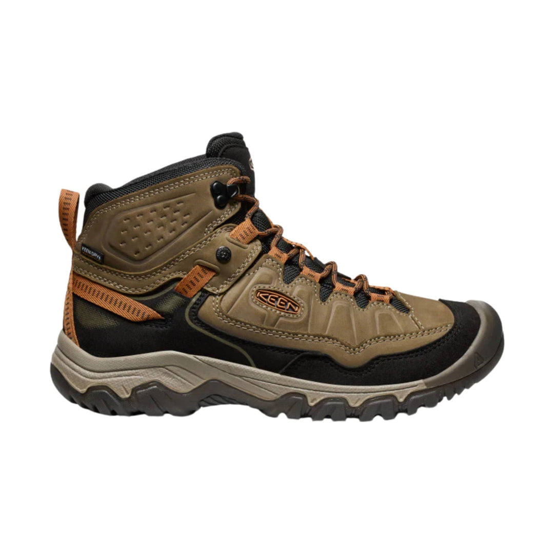Mid-height hiking boot in olive brown and black with orange laces and rugged tread