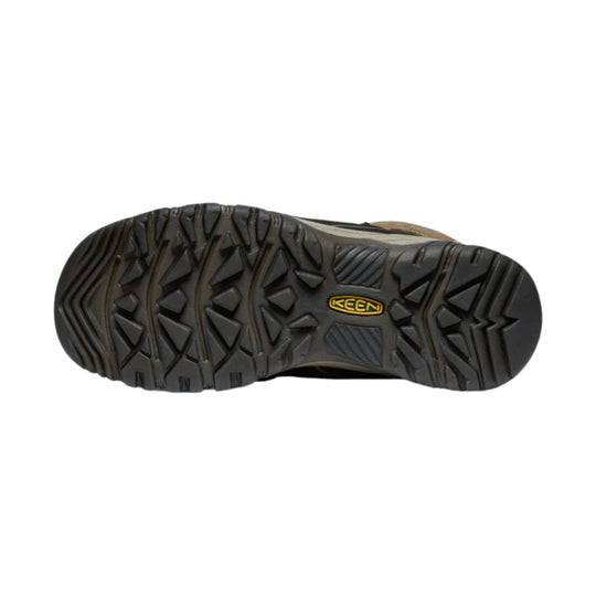 Black hiking boot outsole with deep tread and a KEEN logo