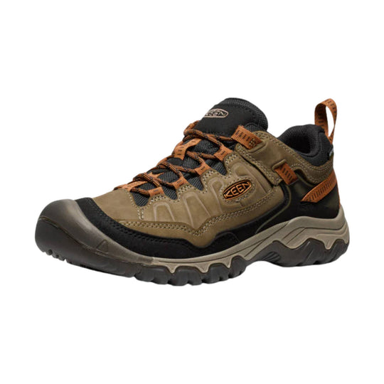 Brown and black hiking shoe with orange laces, a KEEN logo, and a rugged treaded sole
