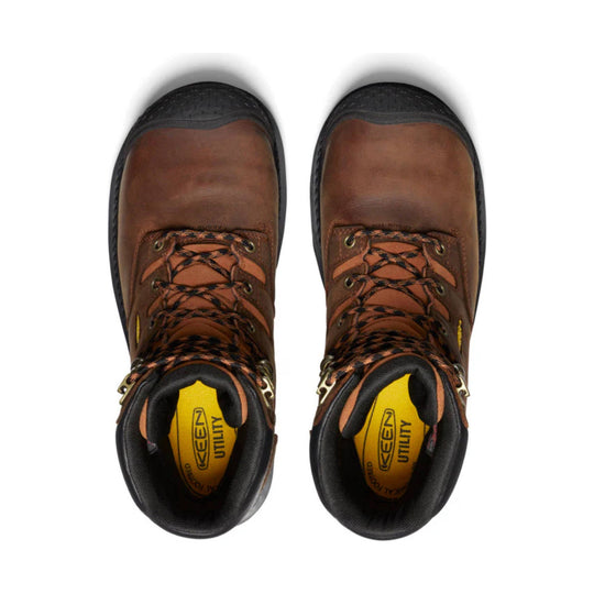 Brown and black insulated work boots, top view, with yellow insoles and black-and-orange laces