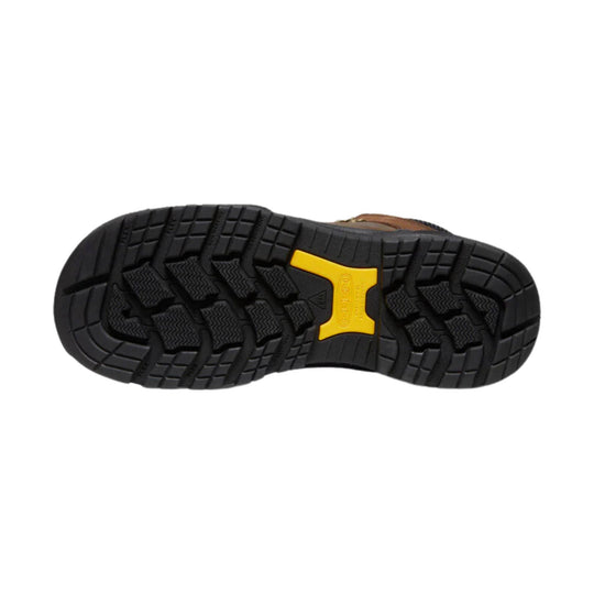 Black rugged boot outsole with deep tread and a yellow KEEN logo insert