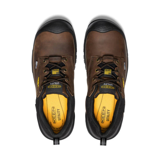 Pair of brown and black low-top work shoes with black toe caps, lace-up uppers, and yellow insoles.