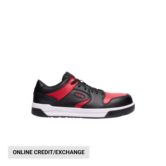 Black and red low-top work shoe with a white midsole and black outsole
