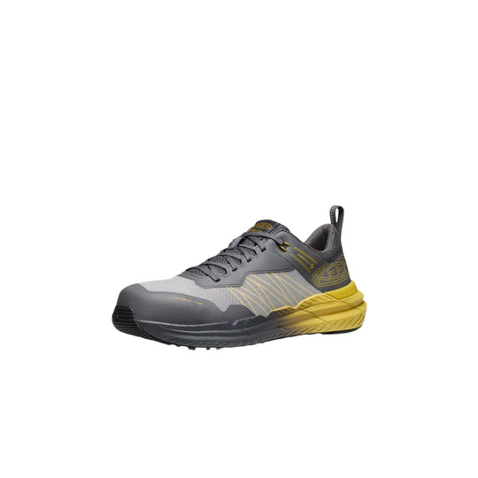 Gray and black low-top work shoe with yellow sole and heel accents, shown in side view.