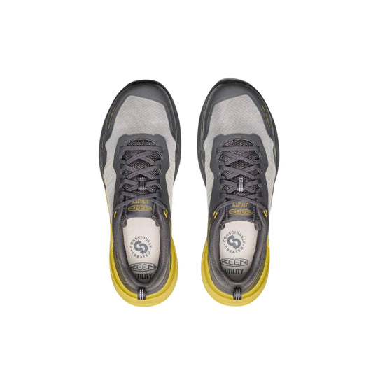Pair of gray and black work shoes with yellow soles and laces