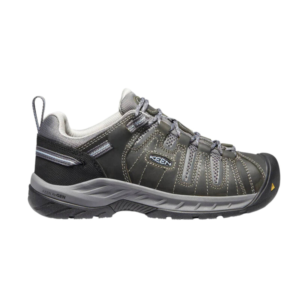 Low-cut gray and black lace-up work shoe with a rubber toe cap and heel pull tab