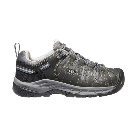 Low-cut gray and black lace-up work shoe with a rubber toe cap and heel pull tab
