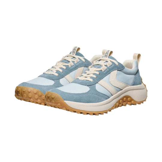 Light blue and cream trail sneakers with suede overlays, cream laces, and gum rubber soles