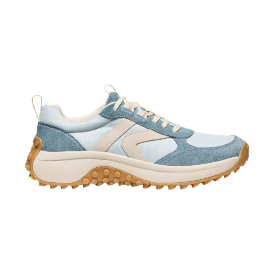 Light blue and cream sneaker with suede overlays, cream laces, and a tan lug sole