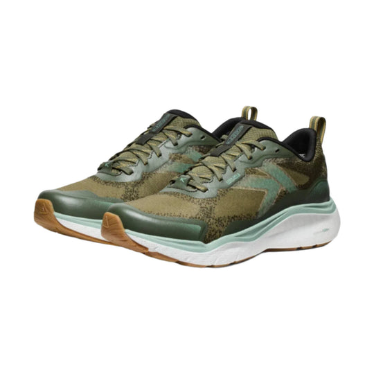Olive green and tan trail shoes with white midsoles, black collars, and gum outsoles