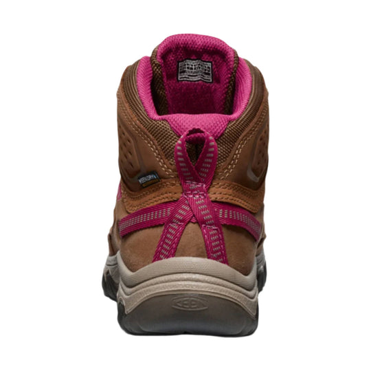 Brown hiking boot with bright pink lining and laces, shown from the back