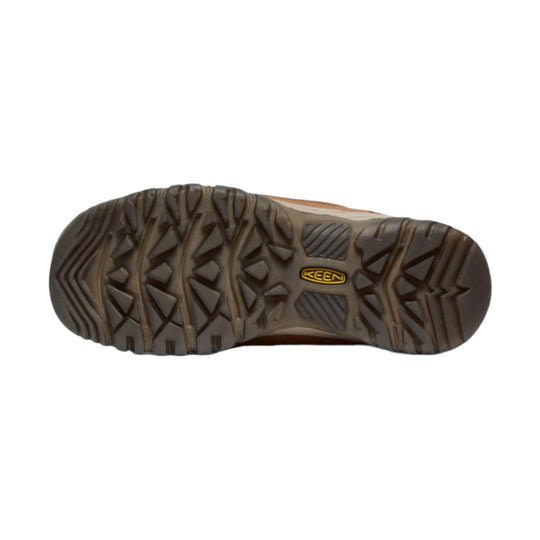 Brown hiking shoe outsole with deep tread and a KEEN logo