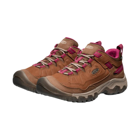 Brown hiking shoes with magenta laces, mesh panels, and black rubber toe caps