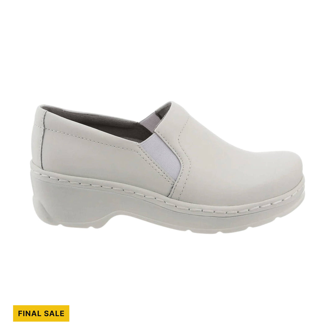 White slip-on clog with a closed toe, low heel, and side elastic panels