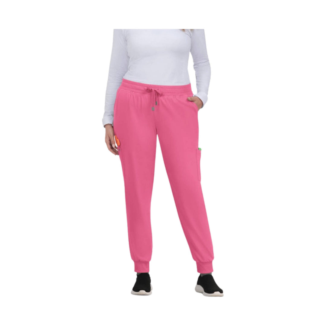 Pink jogger scrub pants with elastic waistband, drawstring, side cargo pockets, and cuffed ankles
