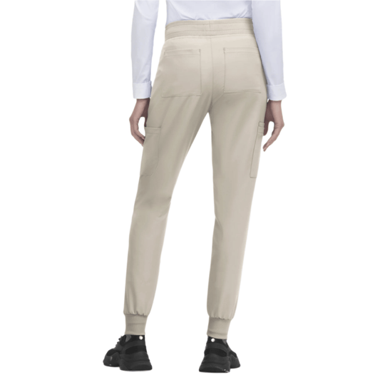 Beige jogger scrub pants with cargo pockets, ribbed ankle cuffs, and a high waistband