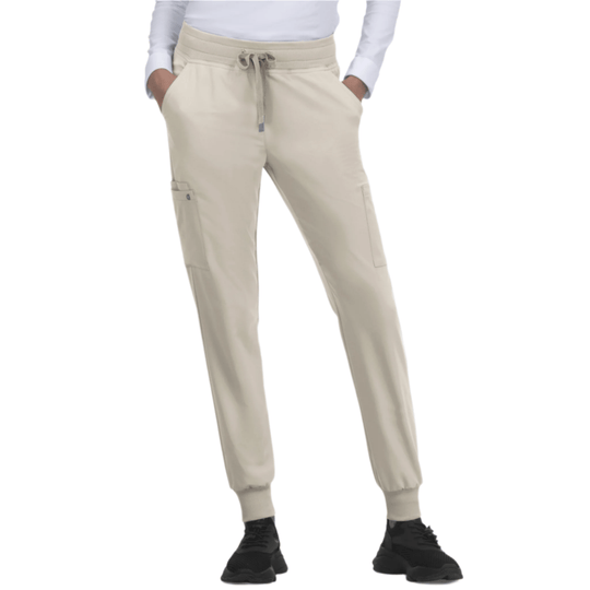 Light khaki jogger pants with elastic cuffs, drawstring waist, and cargo pockets