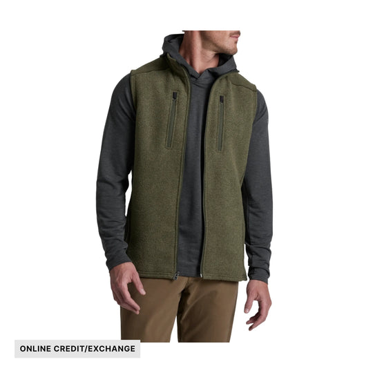 Olive fleece vest over a dark long-sleeve shirt, with front zippers and visible "ONLINE CREDIT/EXCHANGE" text