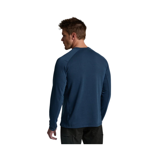 Blue long-sleeve crewneck performance shirt shown from the back