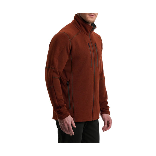 Rust-colored full-zip fleece jacket with stand collar, chest zippers, and side zip pocket
