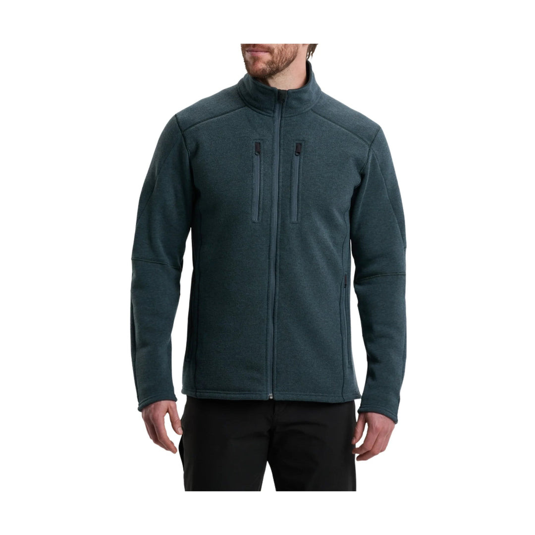 Dark teal full-zip fleece jacket with stand collar, chest pockets, and long sleeves