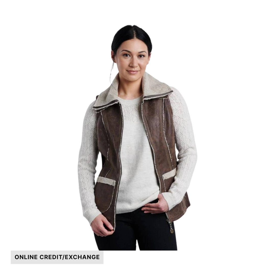 Brown faux-suede vest with cream sherpa collar over a light knit sweater, with ONLINE CREDIT/EXCHANGE text