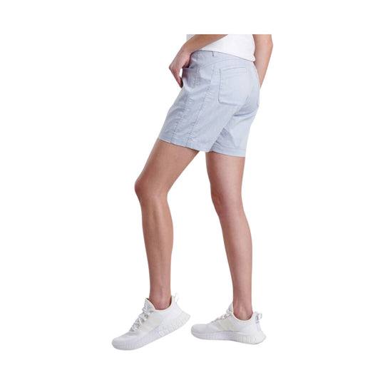 Light blue women’s athletic shorts with side pockets and back pockets, shown on a model