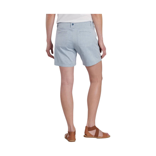 Light blue women’s shorts shown from the back, with rear pockets and a small logo patch