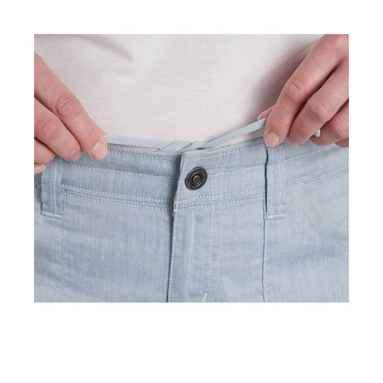 Light blue shorts with a button waist and drawstring being held at the waistband