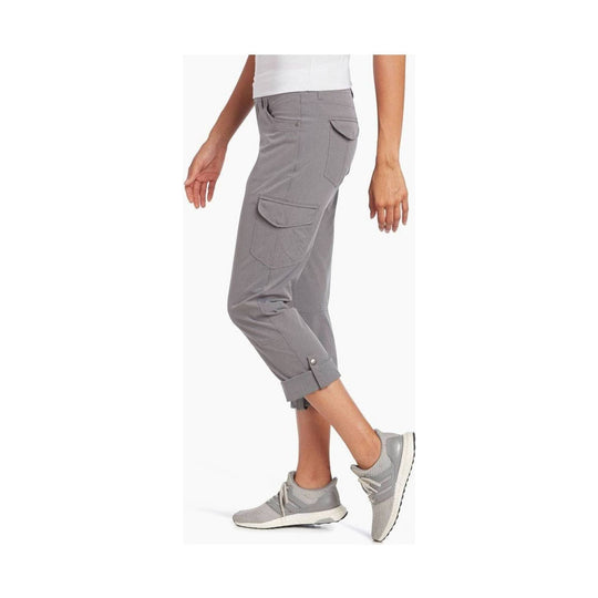 Gray women's cropped cargo pants with roll-up cuffs and side flap pockets, shown on a model in profile
