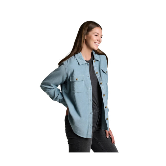 Light blue corduroy button-up shirt jacket with chest pockets, worn open over a dark tee