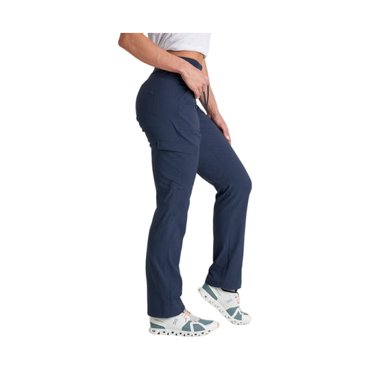 Navy straight-leg pants with cargo pockets, shown on a model wearing white trail shoes