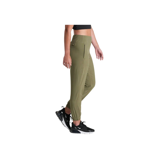 Olive high-waisted jogger pants with side zip pocket and tapered cuffs, worn with black sneakers
