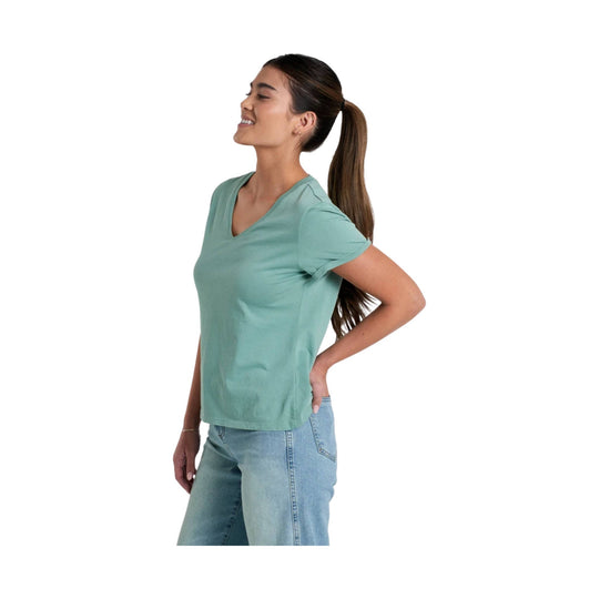 Light sage green V-neck short-sleeve tee worn with light-wash jeans