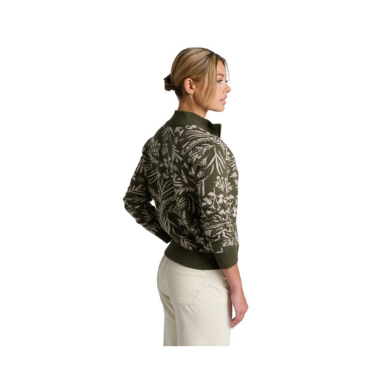 Olive knit sweater with a white leaf pattern, shown from the back in side profile