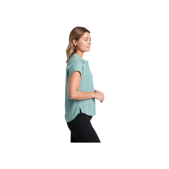 Light teal short-sleeve plaid button-up shirt on a model, side view