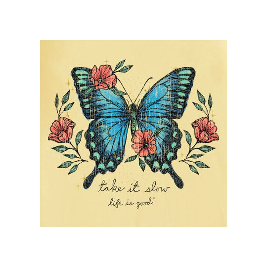 Yellow graphic T-shirt with a blue butterfly and pink flowers, with “take it slow” text