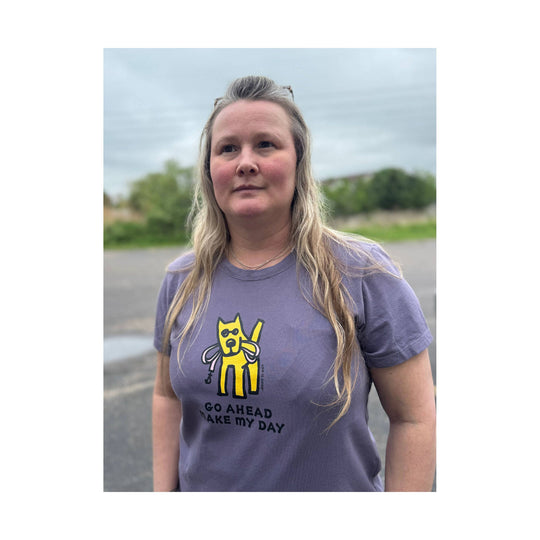 Purple T-shirt with a yellow cartoon dog graphic and the text "GO AHEAD MAKE MY DAY"
