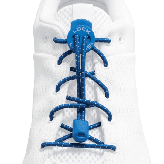 White athletic shoe lacing system with blue bungee cords and toggle closures