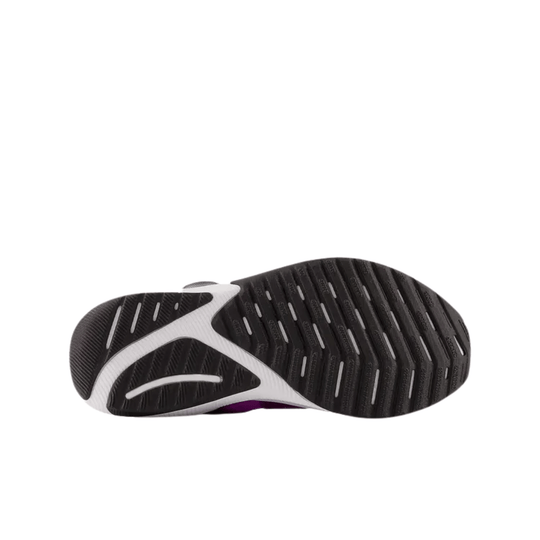 Black and white sneaker outsole with grooved tread and purple accent