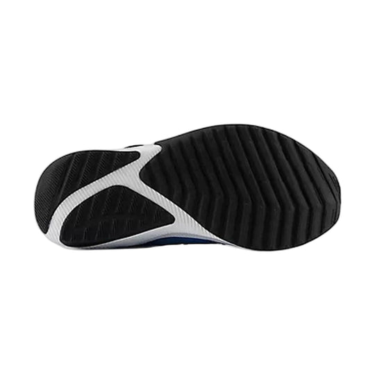 Black and white sneaker outsole with textured tread and blue accent at the arch