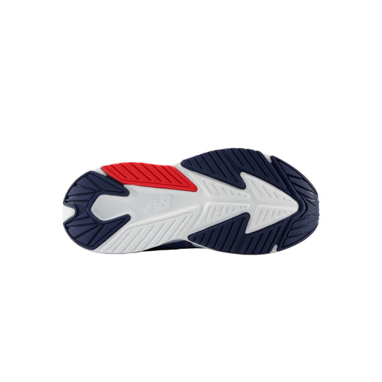 Sneaker outsole with navy, white, and red traction panels