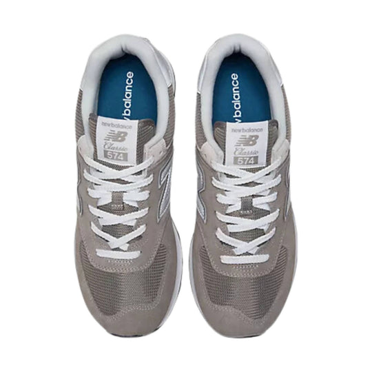 Light gray New Balance sneakers shown from above with white laces and blue insoles