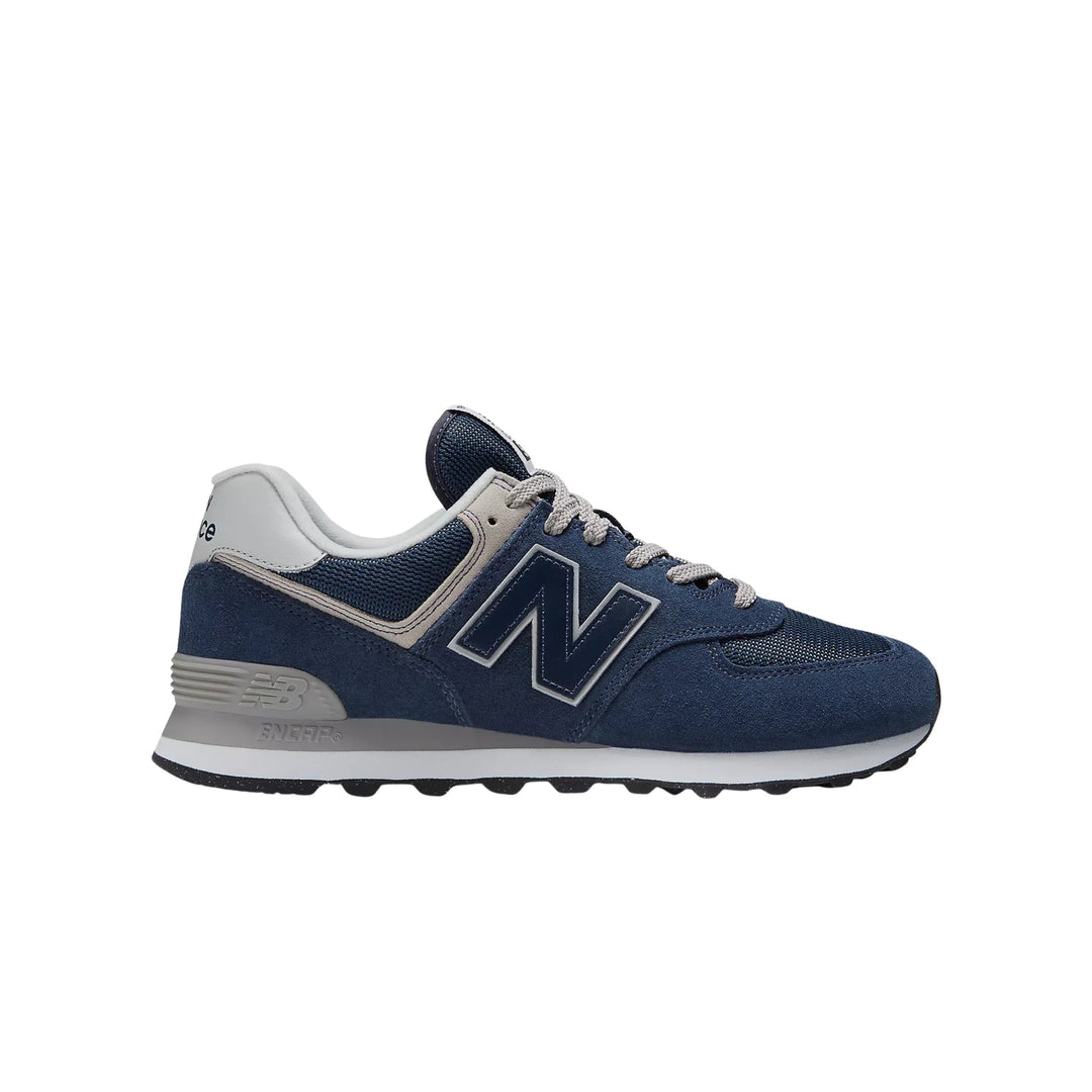 Navy and gray low-top sneaker with white laces and a large side logo, shown in profile