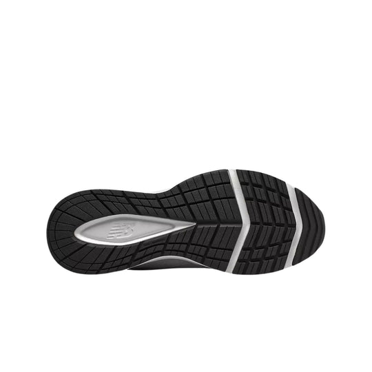Black rubber shoe sole with white flex grooves and a New Balance logo