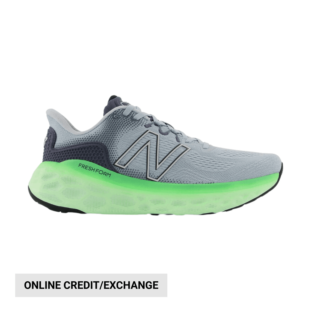 Gray running shoe with neon green midsole and large side logo