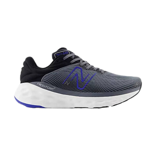 Gray and black running shoe with a white cushioned sole and blue side logo
